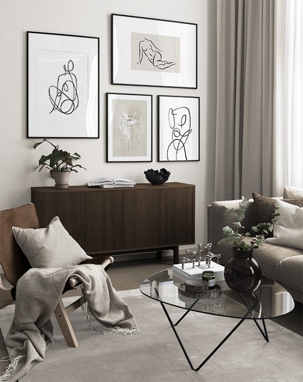 Black-and-white illustrations in black frames in living room